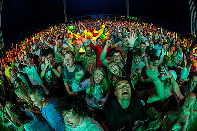 DJ and crowd at disco night.